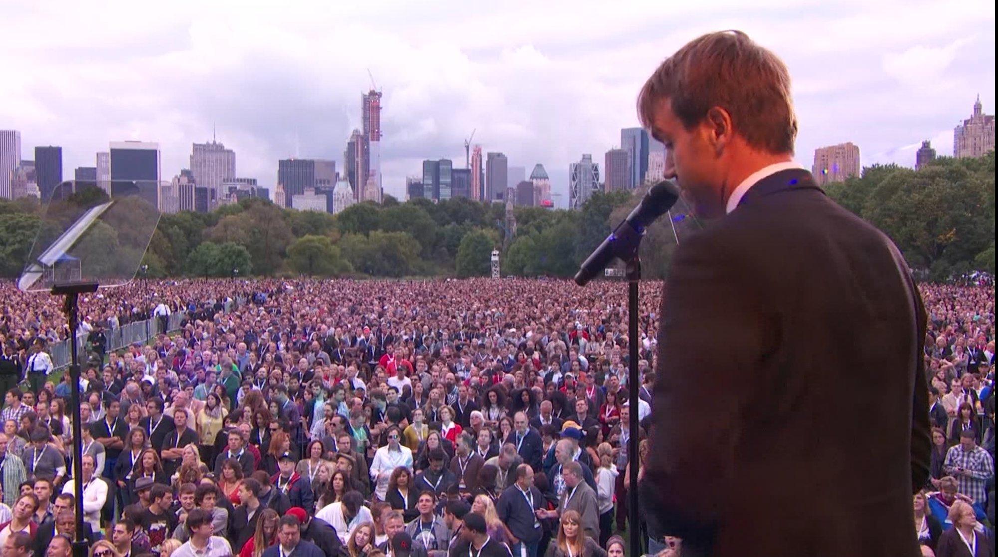 Michael Trainer addressing the crowd at the inaugural Global Citizen Festival, Central Park, with the New York skyline behind them